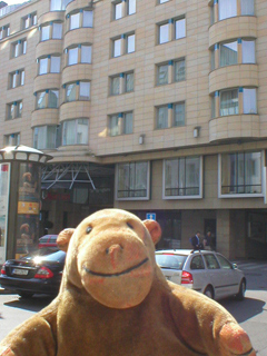 Mr Monkey looking at the outside of the Prague Marriot Hotel