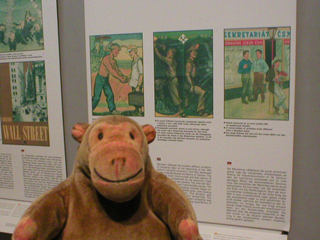 Mr Monkey reading a display about propaganda