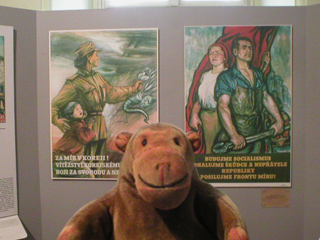 Mr Monkey looking at Communist posters