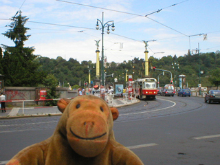 Mr Monkey looking at the Čhechův bridge