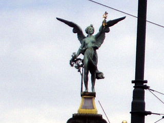 A statue on a pillar on Čhechův bridge