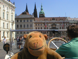 Mr Monkey in Hradcranske namesti looking at Prague Castle