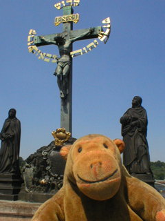 Mr Monkey looking at the 17th century wooden crucifix