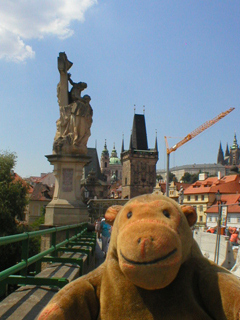 Mr Monkey looking at the towers at the Lesser Town end of the bridge