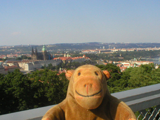 Mr Monkey looking at Prague Castle from the terrace of the tower