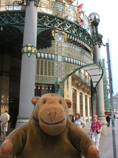 Mr Monkey looking at the front of the Municipal House