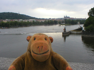 Mr Monkey looking at the Vltava from  Jiráskův bridge