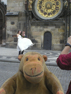 Mr Monkey spotting newly-weds beneath the Astronomical Clock