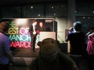 Mr Monkey watching Richard Cheetham get the music award from Luke Bainbridge