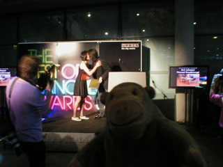 Mr Monkey watching Naomi Kashiwagi get the music award from Peter Saville