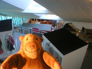 Mr Monkey looking down from the top floor of Urbis