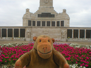 Mr Monkey in front of the Portsmouth Naval Memorial