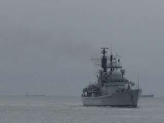 HMS Gloucester sailing towards the camera in the Solent