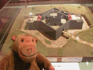 Mr Monkey looking at a model of Southsea Castle