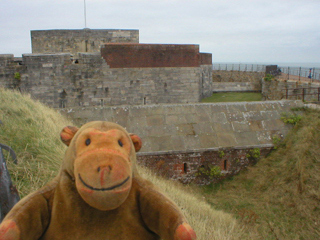 Mr Monkey looking at the outside of the castle from the west