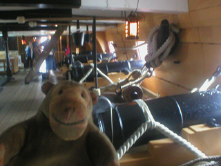 Mr Monkey looking at guns on the upper gun deck