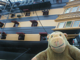 Mr Monkey looking at the side of HMS Victory