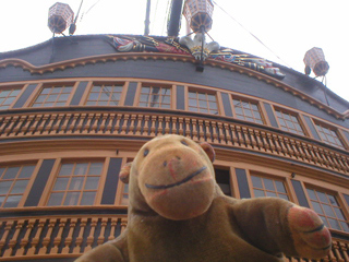 Mr Monkey looking up at the stern of HMS Victory