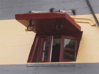 A combined window and gunport in the captain's quarters