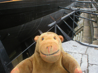 Mr Monkey looking at the side of HMS Victory below the waterline