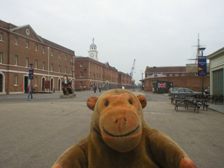 Mr Monkey looking at Georgian buildings in the dockyard