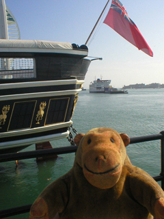 Mr Monkey looking at the stern of HMS Warrior