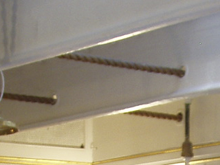 Ropes controlling the rudder passing through the roof beams of the wardroom