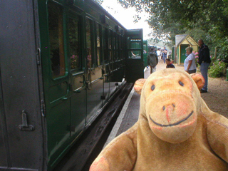 Mr Monkey looking at the train carriages
