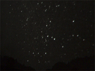 Night stars above a Hakka house