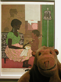 Mr Monkey looking a poster of a woman giving a toy gun to her son