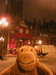 Mr Monkey looking at the Santa outside the town hall