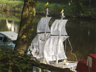 The pirate rowing boat moored with its lights off