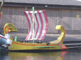 The Greek galley moored beside the rowing club