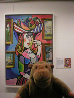 Mr Monkey looking at the artwork for Femme Bien Informée