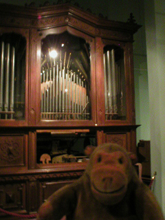 Mr Monkey looking at an Imhof and Muckle Orchestrion