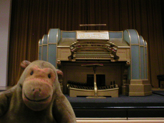 Mr Monkey looking at a Wurlitzer organ