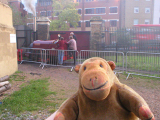 Mr Monkey watching mechanics working on the steam locomotive Cloister