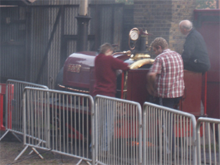 Mechanics trying to fix the steam locomotive Cloister