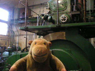 Mr Monkey looking at the flywheel of the Allen Diesel