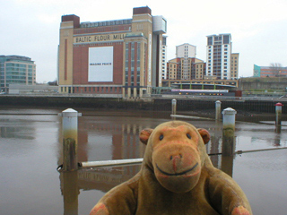 Mr Monkey looking at the Baltic from the Millennium Bridge