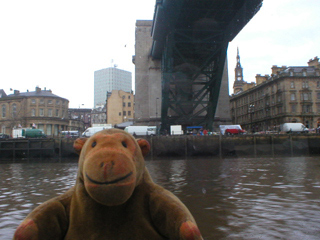 Mr Monkey looking up at the Tyne Bridge