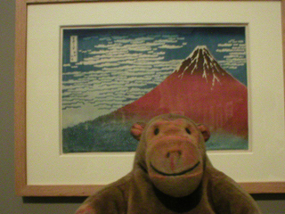 Mr Monkey looking at South Wind, Clear Sky (Red Fuji) by Hokusai