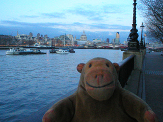 Mr Monkey looking down the Thames at dusk