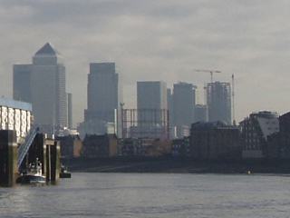 Canary Wharf's towers seen from a boat near Wapping