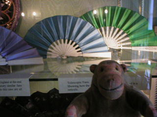 Mr Monkey looking looking at some telescoping fans