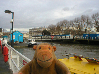 Mr Monkey looking at the Royal Naval College from Greenwich pier