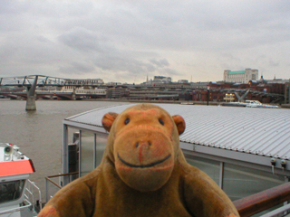 Mr Monkey looking upriver from the Bankside pier