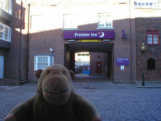 Mr Monkey outside his hotel