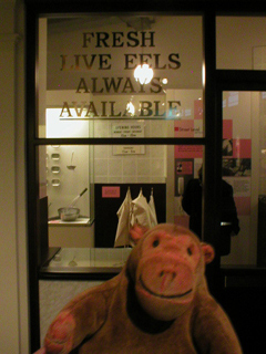 Mr Monkey looking at a recreated eel pie shop