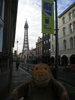 Mr Monkey looking at Blackpool Tower from Corporation Street